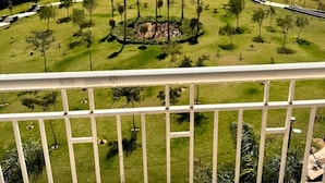 A residential complex with multiple apartment buildings, a central landscaped area with trees, and a clear sky. - ALSAWAH Modern 2BR Apartment - Madinty (Second New cairo)