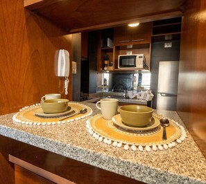 Private kitchen - Cozy apartment in Providencia near Cost Center, steps from the subway, free parking. (Providencia)