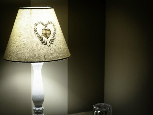 A lamp with a heart-shaped design on the lampshade.