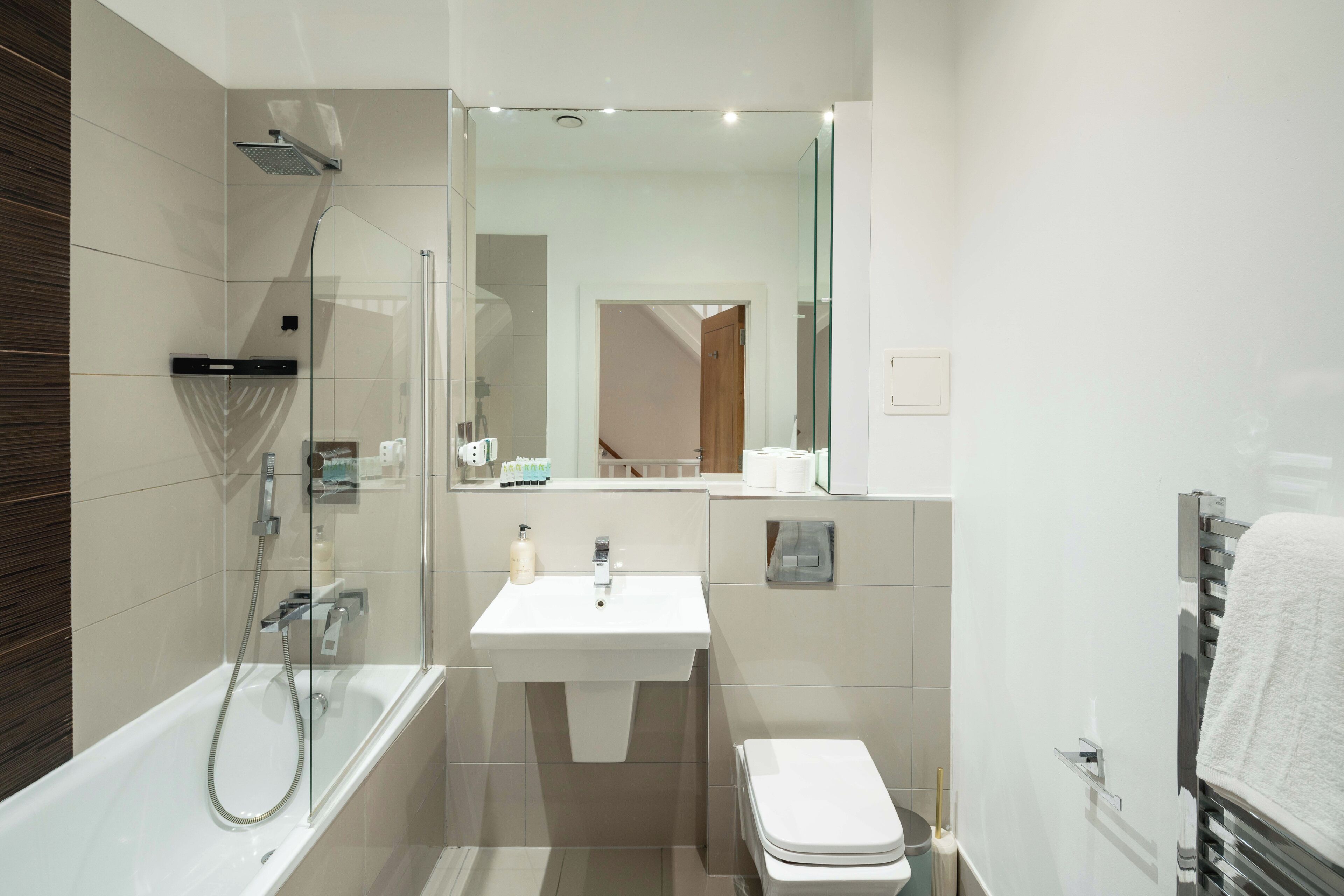 Shower, hair dryer, towels, toilet paper
