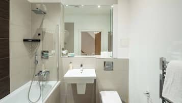 Shower, hair dryer, towels, toilet paper
