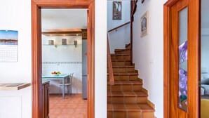 A kitchen with a dining table, a refrigerator, and a cabinet. - Casa Margarita in Rada (Rada)