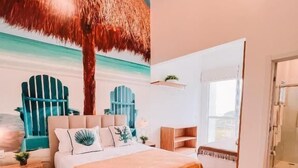 A bedroom with a bed, a nightstand, a chair, a window, and a door. - Casa cancun hotel boutique e eventos (Penha)