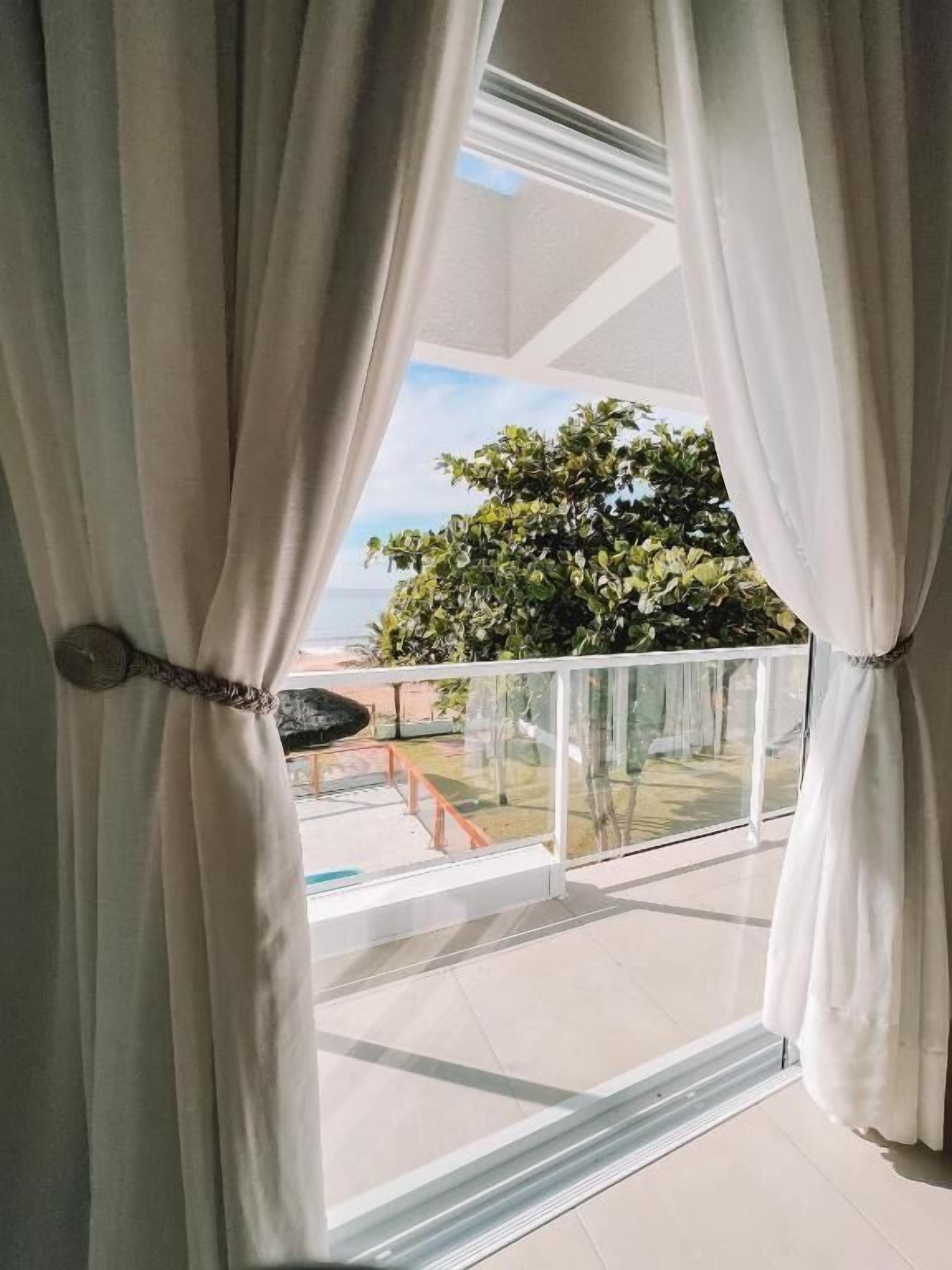 Suíte, sacada, vista para o jardim | Parte interna