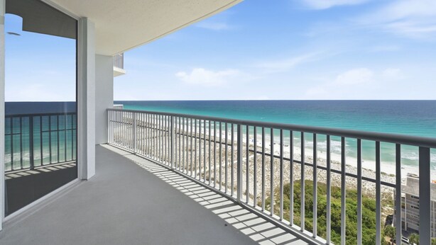 A balcony with a view of the ocean and beach. - "Heaven on Top" – 15th-Floor Gulf Views, Pool & Hot Tub , Steps to Beach (Pensacola Beach)