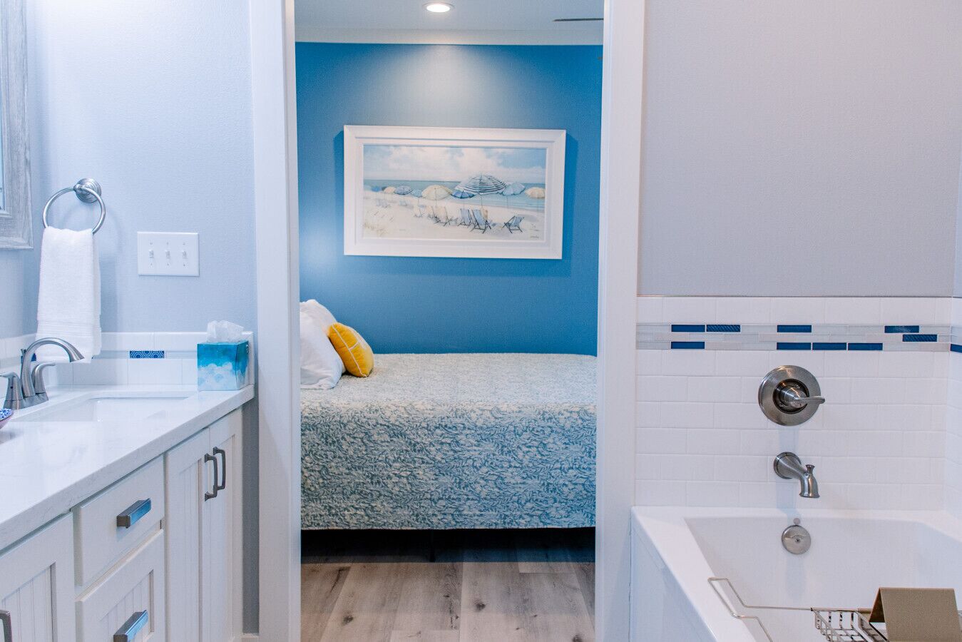 A bathroom with a bathtub, a sink, and a shower.
