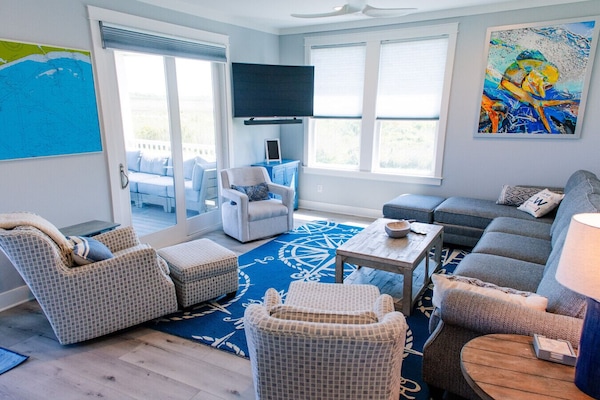 This beautiful coastal themed home is bright and airy and oh-so-comfortable