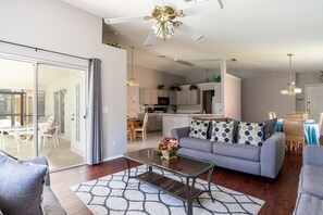 Living area - Enchanted 3BR pool home 10 mins to Disney (Kissimmee)