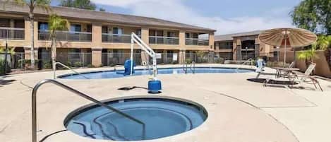 Enjoy a refreshing dip in the pool or relax in the hot tub under the sunny skies.