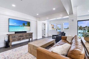 TV - Newly Remodeled 4 Bedroom House + Dock, Steps to Beach, Gulf Views, Sunsets, Boat Friendly Retreat. (Treasure Island)