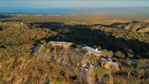 A remote, rustic property with multiple buildings surrounded by dry vegetation and a clear view of the landscape. - Ancón Vistamar (Los Encinitos)