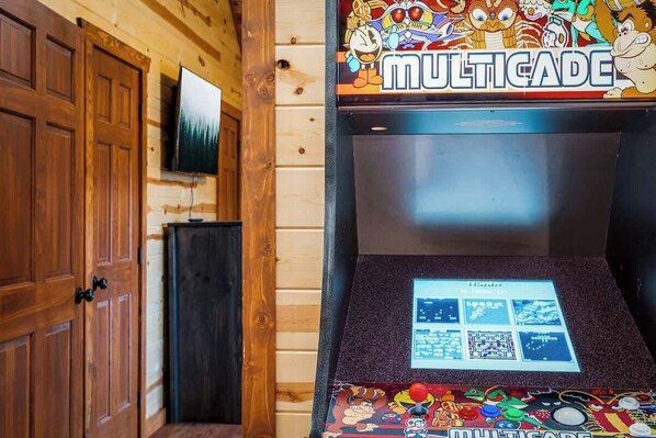 A wooden interior with a Multicade arcade machine.