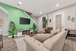 TV, fireplace - NEW Stylish Jungle Theme • Near Houston Hotspots (Houston)