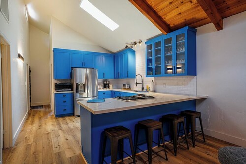 Renovated 4-bedroom cabin with 2 primary suites, 2 living areas and a huge deck.