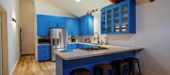 Renovated 4-bedroom cabin with 2 primary suites, 2 living areas and a huge deck.