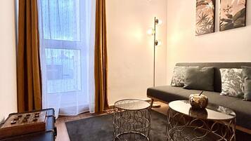 Panoramic Double Room | Living area | 40-inch LED TV with cable channels