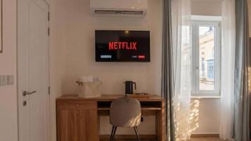 Habitación Deluxe con 1 cama doble o 2 individuales, vistas a la ciudad | Interior