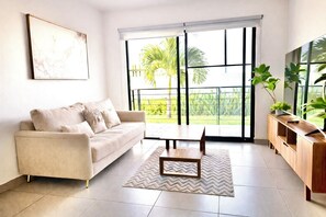 Living area - Resort-Style Condo- Pool, Patio, Playground + Palapa Lounge (Aldea Hortus)