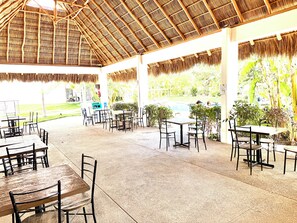 Outdoor dining - Resort-Style Condo- Pool, Patio, Playground + Palapa Lounge (Aldea Hortus)