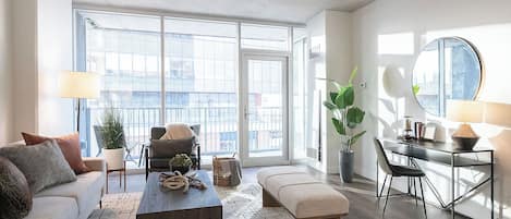Deluxe Apartment, Partial Lake View | Living area | 65-inch flat-screen TV with digital channels