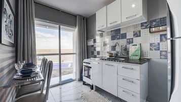 Apartamento conforto, cozinha, vista para a praia | Cozinha privada
