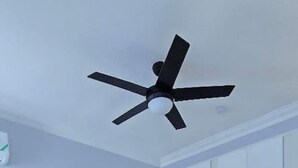 A bedroom with a bed, a ceiling fan, a TV, a wardrobe, and a mirror. - Choose To Be Happy @ SkyView #3 (Kingston)
