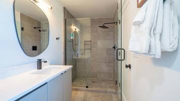 Shower, hair dryer, towels, shampoo