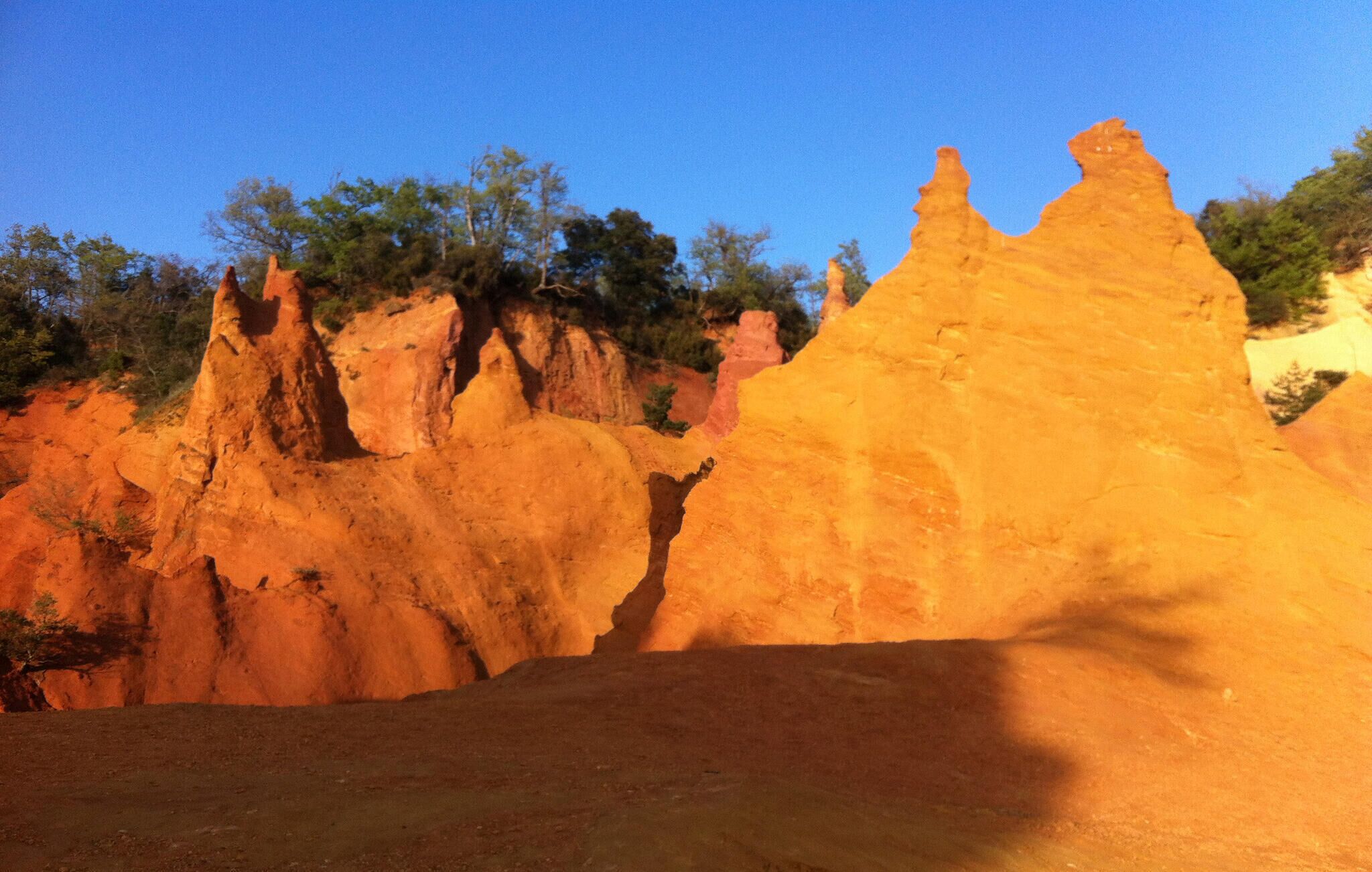 A natural rock formation with a clear sky.