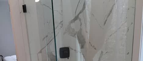 Shower, towels, soap, toilet paper