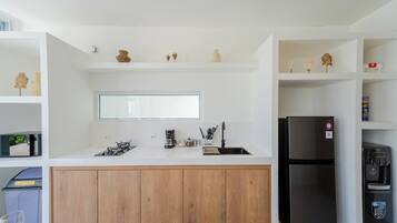 Fridge, coffee/tea maker, paper towels, kitchen islands