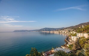 A coastal town with buildings along the waterfront, a clear sky, and calm sea. - 3 bedroom pet friendly apartment in Varazze (Varazze)