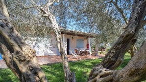 A house with a patio, outdoor furniture, and a garden. - Stunning home in Pescia Romana with WiFi (Pescia Romana)