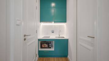 Mini-fridge, stovetop, cookware/dishes/utensils