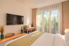 A hotel room with a bed, a desk, a television, and a window with curtains. - Amana Boutique Hotel - Tran Quoc Thao (Ho Chi Minh City)