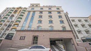 A multi-story hotel with a prominent 'HAYWARD HOTEL' sign, a parking entrance, and a white car parked in front. - Daegu Dongdaegu Station H Avenue Dongdaegu Station Branch (Daegu)