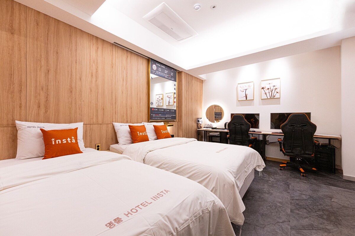 Twin Room (random design assignment) | Premium bedding, down comforters, soundproofing, WiFi (free)