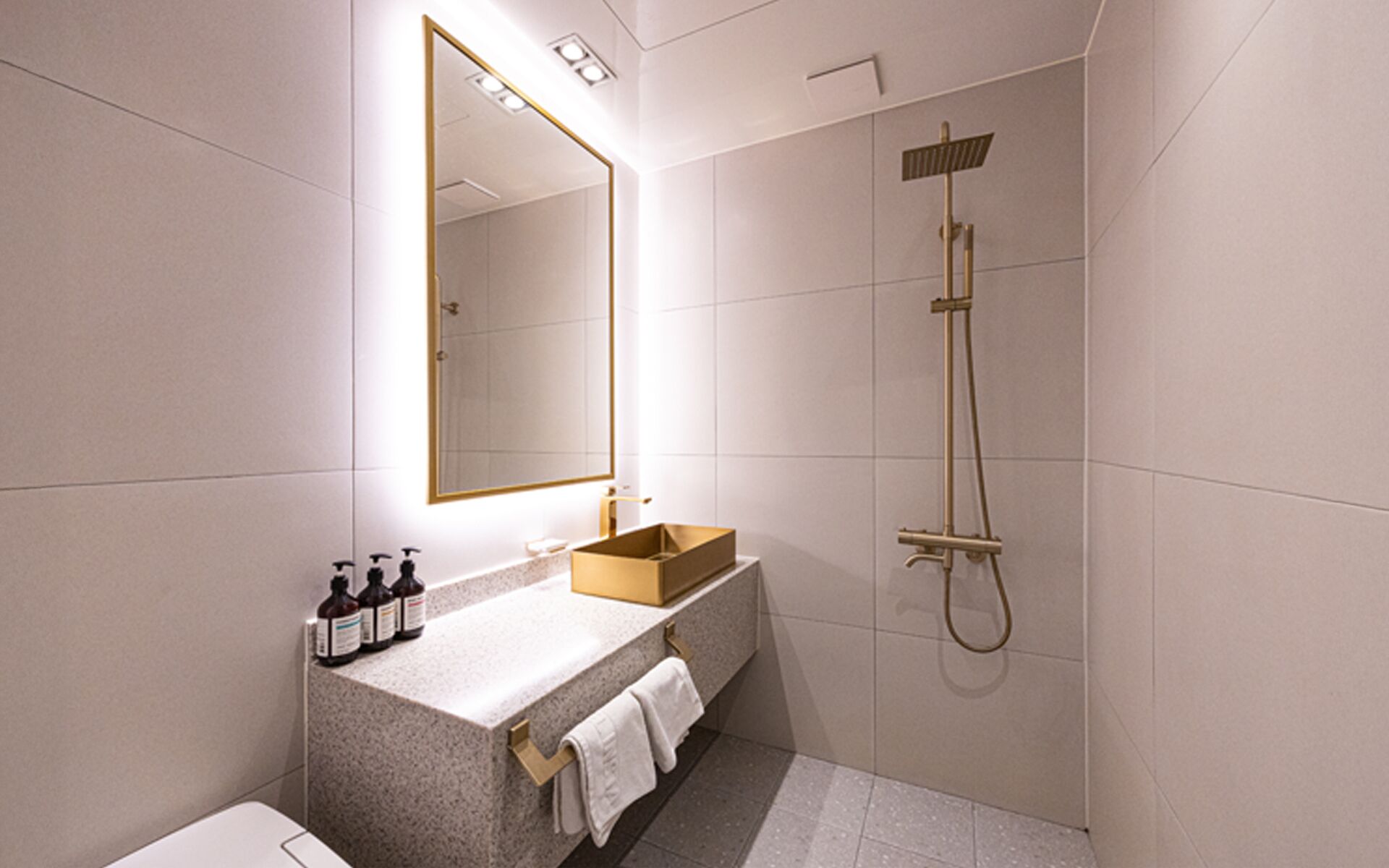 Designer toiletries, hair dryer, bathrobes, slippers