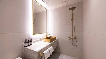 Designer toiletries, hair dryer, bathrobes, slippers