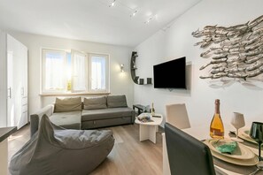 Family Apartment, Multiple Bedrooms (Margherita Apartment) | Living area | TV - Margherita Apartment (Malcesine)