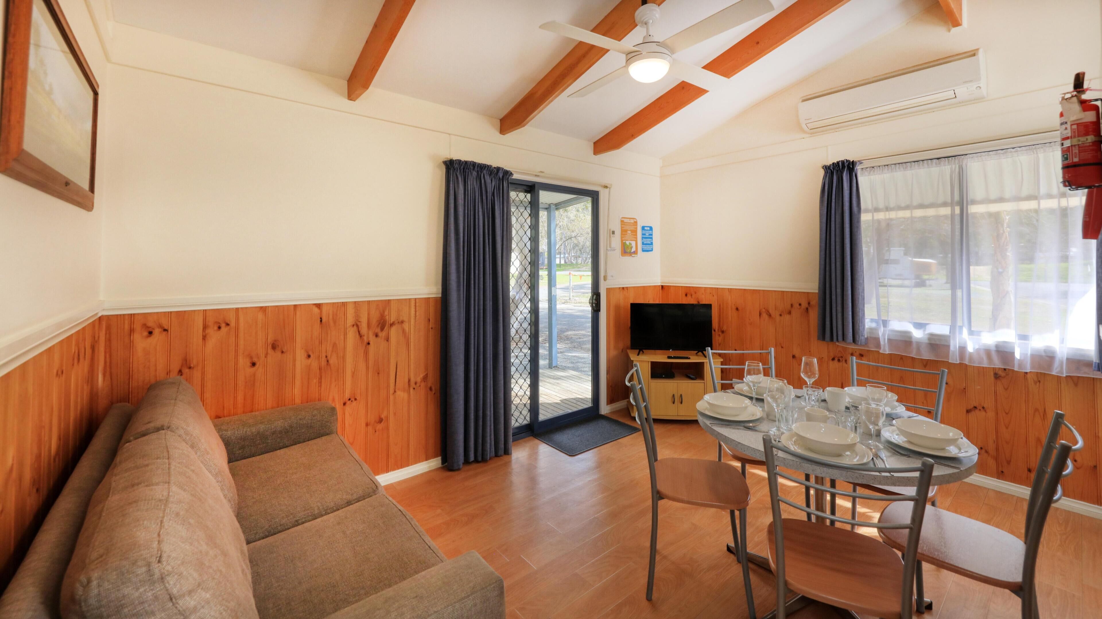Standard Cabin, Balcony, Garden View | Living area