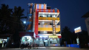 A multi-story building with signage for 'Netrani Residency.'