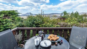 A table with breakfast items and a scenic view. - 2 bedroom accommodation in Trawsfynydd (Trawsfynydd)