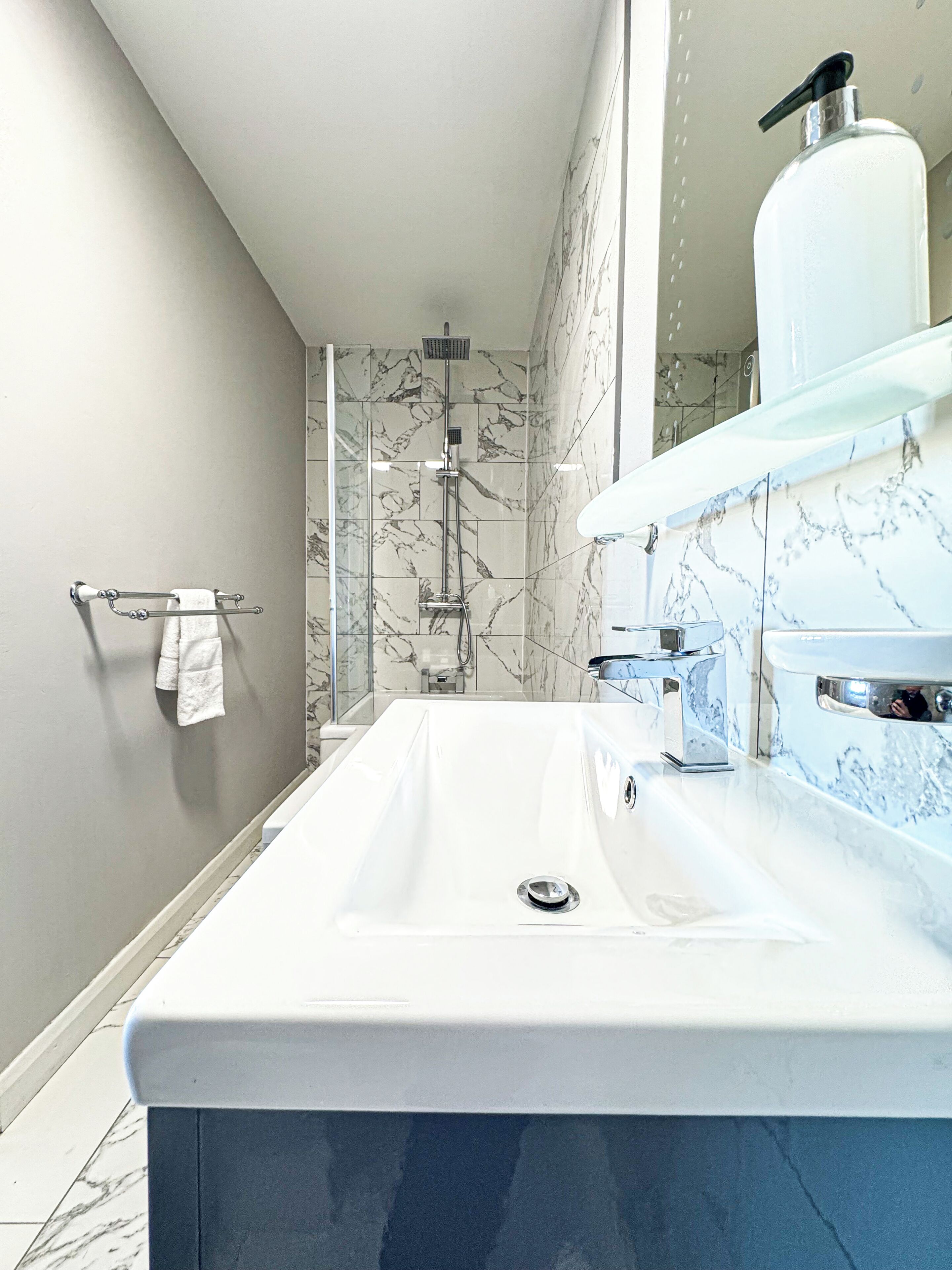 Shower, towels, soap, toilet paper