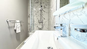 Shower, towels, soap, toilet paper
