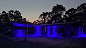 A two-story building with a covered outdoor area, surrounded by trees. - The Anunaka on Wadandi Boodja (Margaret River)