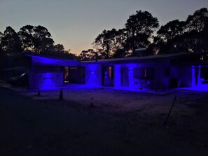 A two-story building with a covered outdoor area, surrounded by trees. - The Anunaka on Wadandi Boodja (Margaret River)