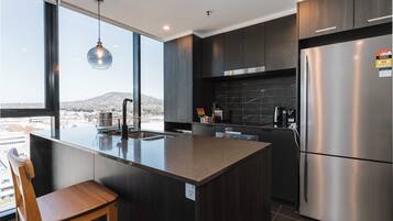 Coffee/tea maker, fridge, microwave, oven