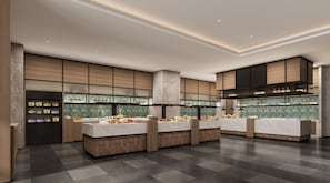 Uma cozinha moderna com bancadas múltiplas, uma ilha central e um exaustor grande sobre a pia.