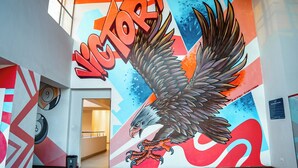 A mural of an eagle with the word 'VICTORY' in bold letters, set against a colorful geometric background. - Modern 2 Bedroom Westlands Nairobi,  with AC, Rooftop Pool, Gym, Squash Court (Nairobi)