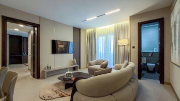 Executive appartement, balkon, uitzicht op zwembad | Woonruimte